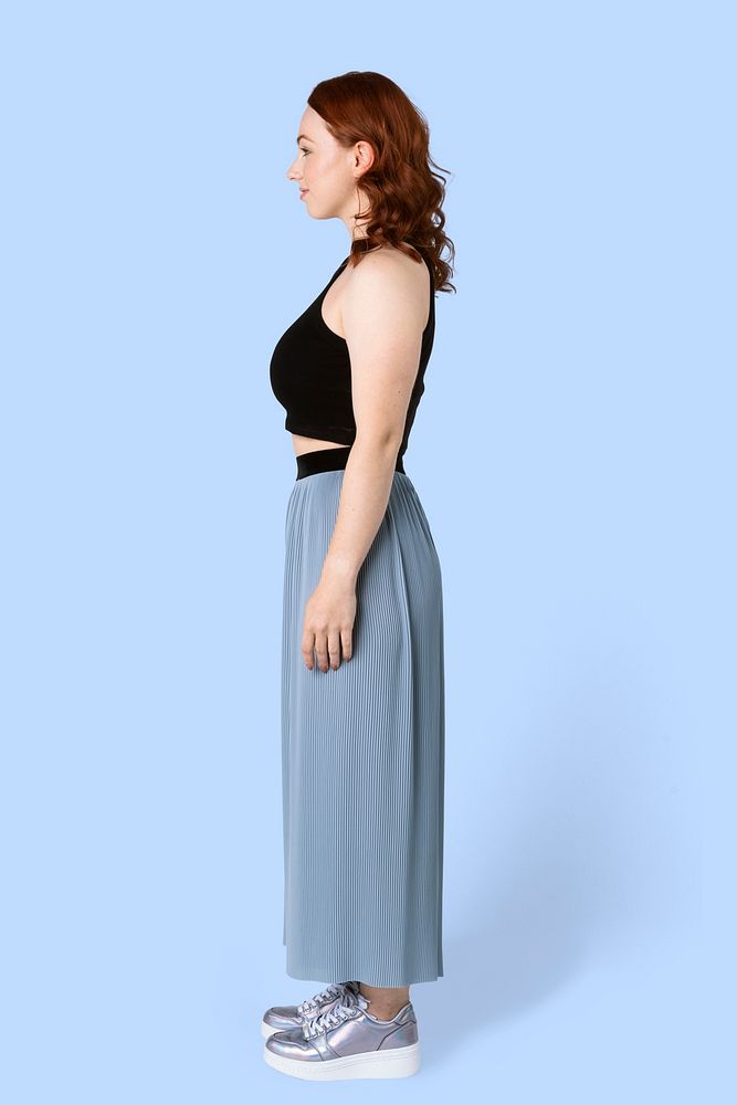 Woman wearing a crop top and skirt pants in a profile shot mockup 