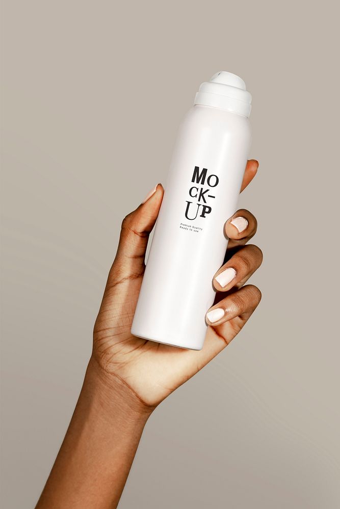 Black woman holding a white spray bottle mockup