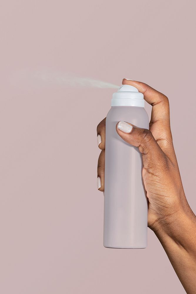 Black woman using a spray bottle psd mockup