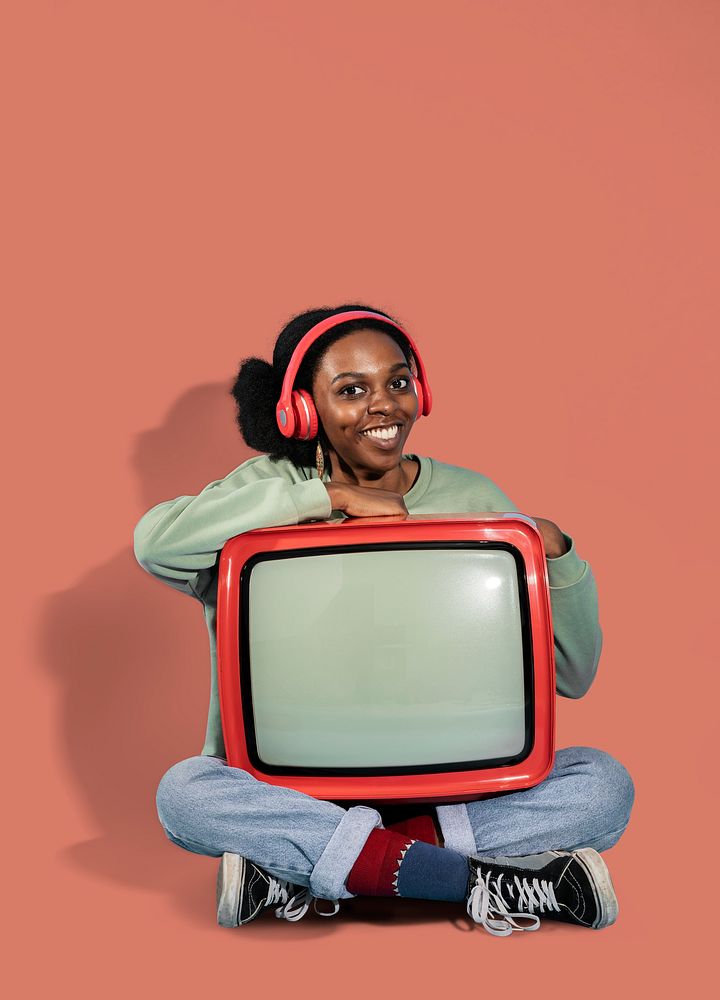 Black woman sitting with a retro television mockup