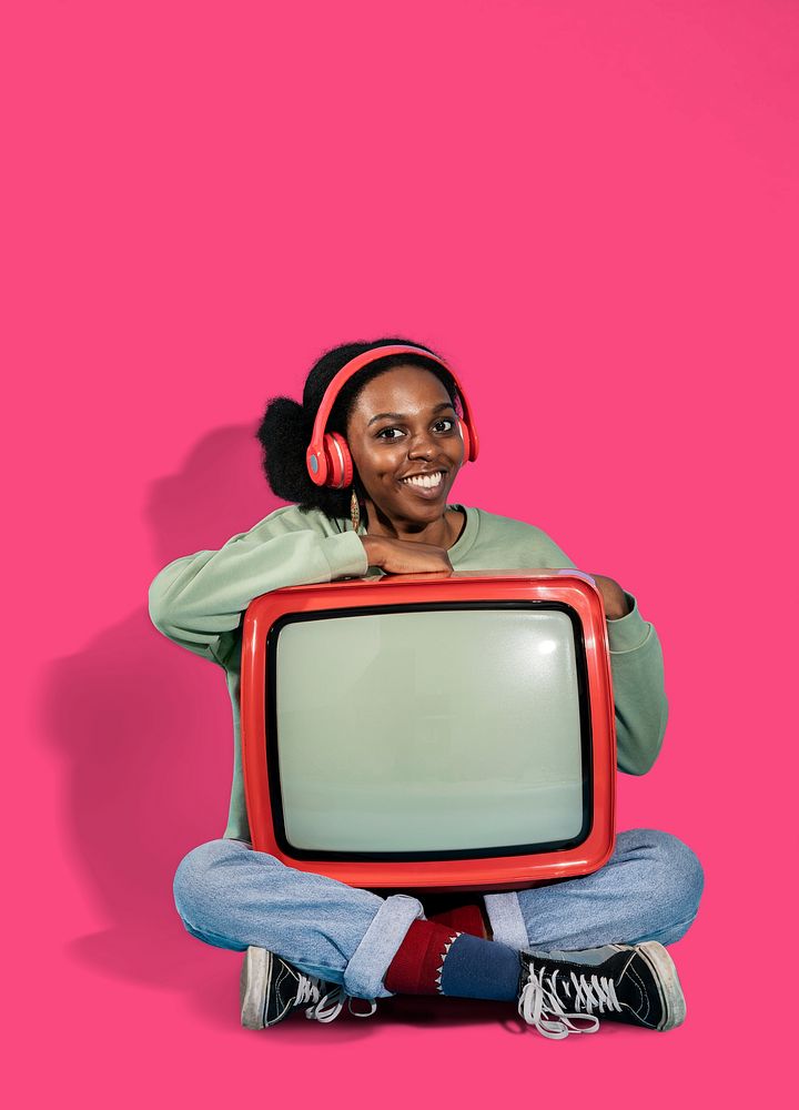 Black woman sitting with a retro television mockup