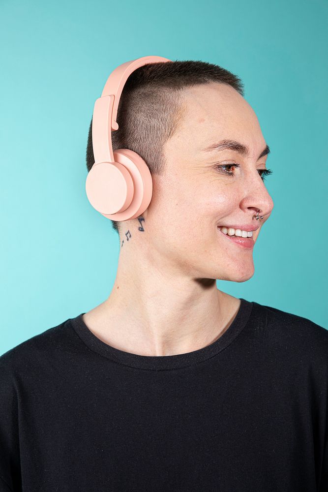 Shaved hair woman with headphones