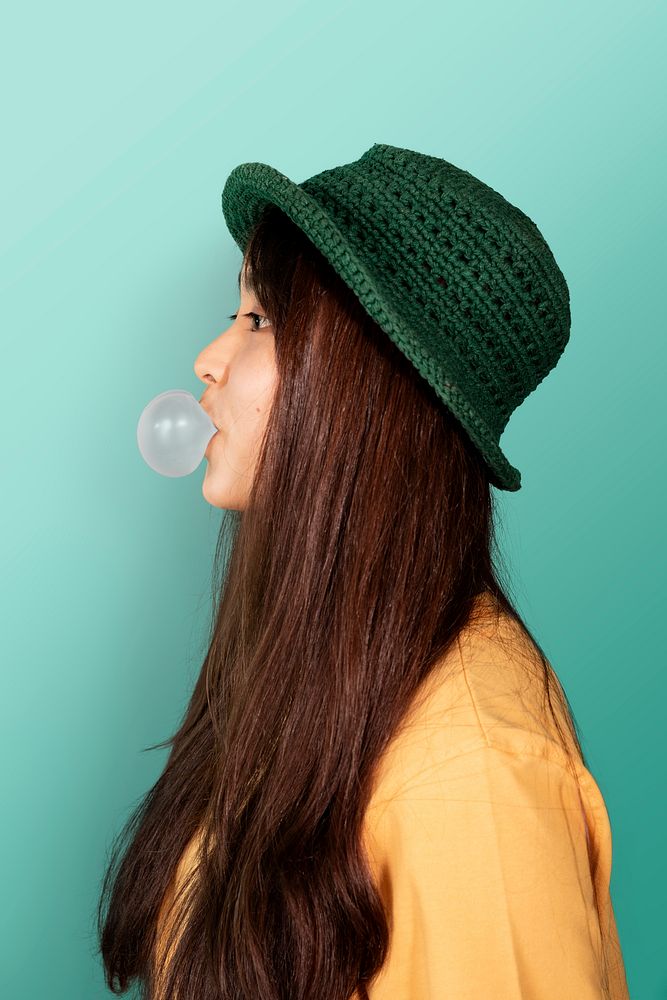 Cheerful girl blowing a bubble gummockup