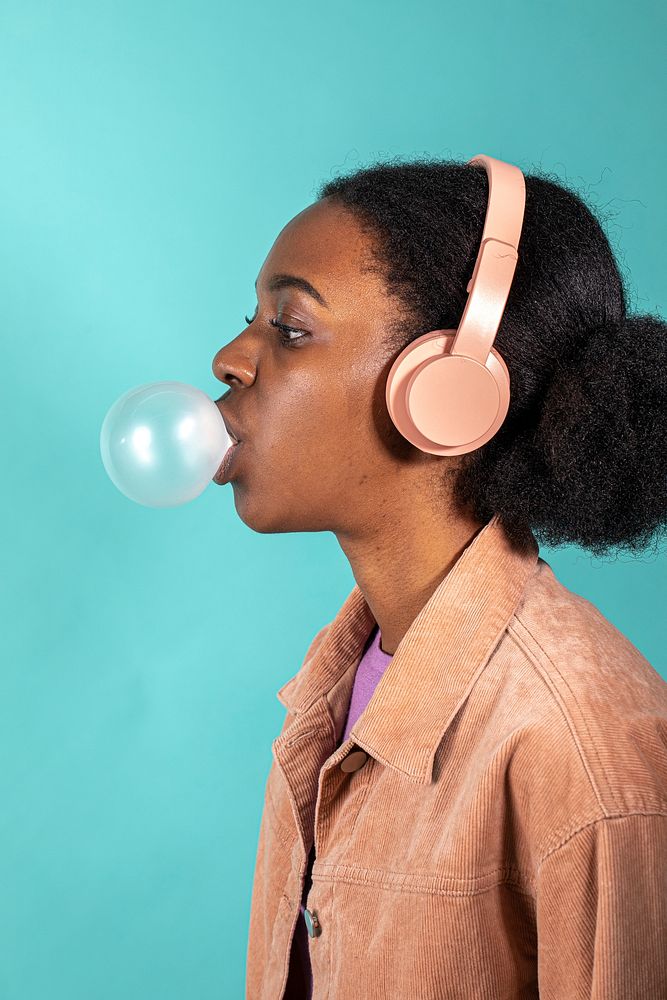 Cute woman wearing a pink headphones