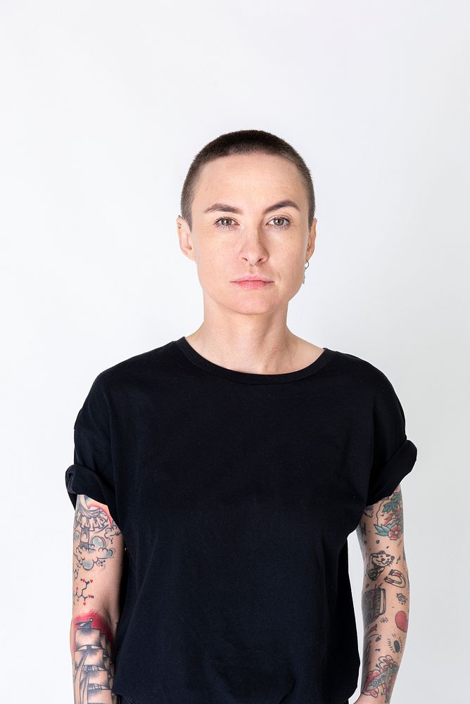 Skinhead model with tattoos in a black T shirt