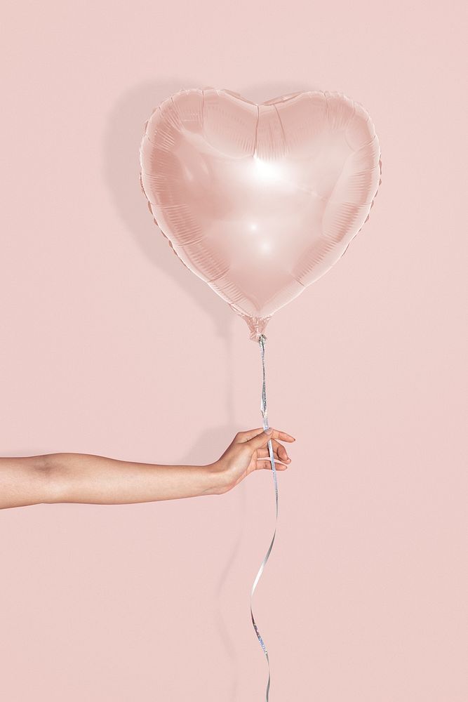 Heart shaped balloon mockup on a pink background