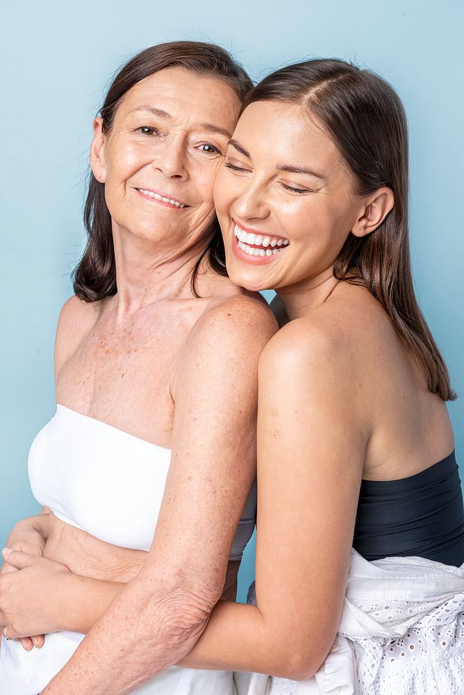 Happy mother and daughter hugging 