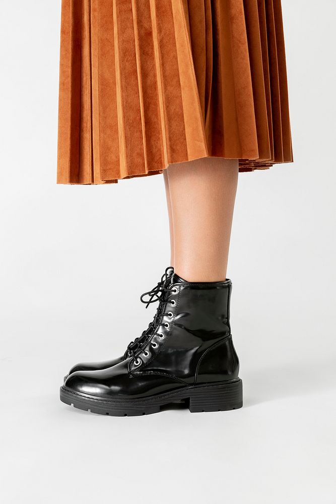 Woman in a skirt wearing combat boots 