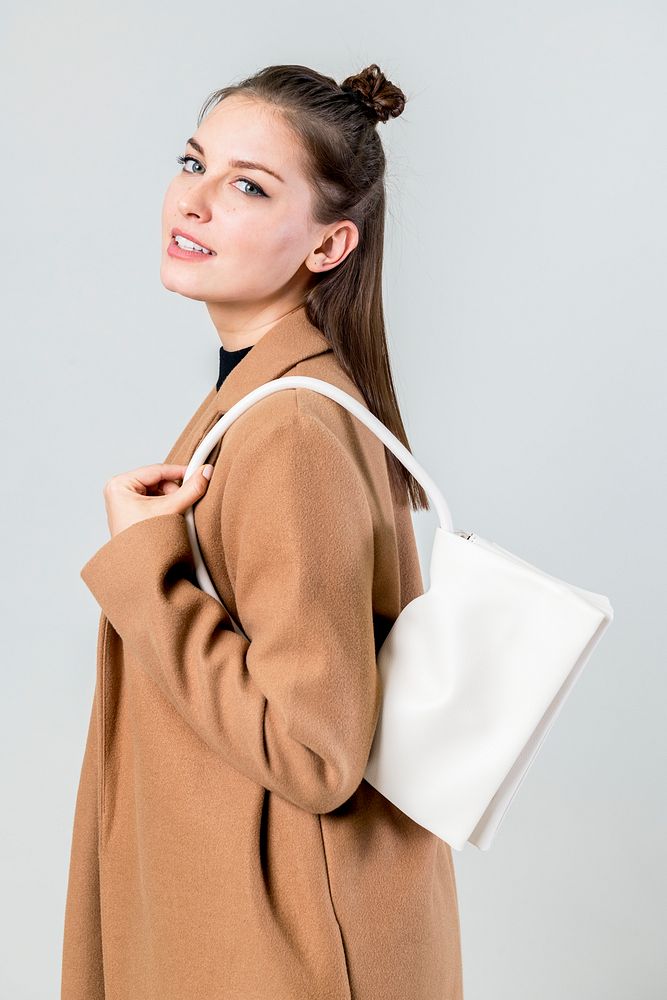 Woman with a white hand bag