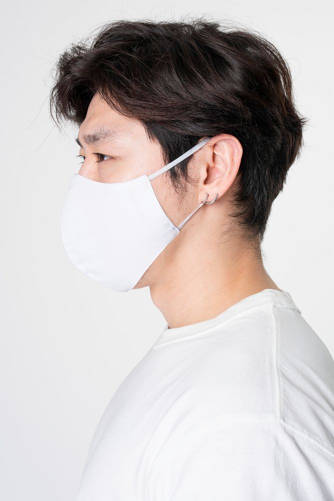 Man wearing face mask and abstract printed t-shirt studio portrait