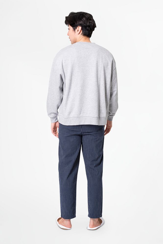 Man in gray sweater and pants sleepwear apparel rear view