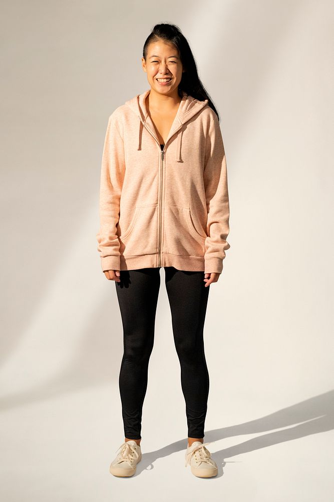 Asian woman in orange pastel jacket sportswear apparel full body