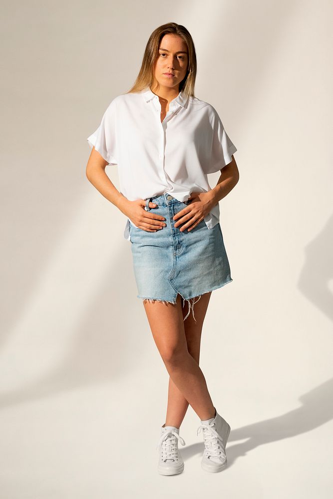 Blonde woman in white t-shirt and denim mini skirt casual wear fashion full body