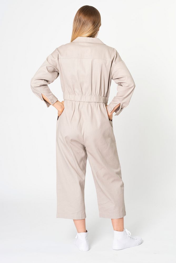 Blonde woman in beige jumpsuit with design space streetwear apparel