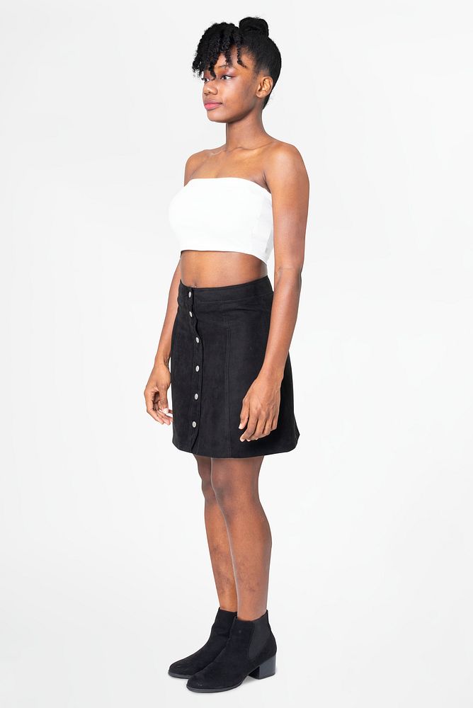 Woman in white bandeau top and black a-line skirt casual fashion