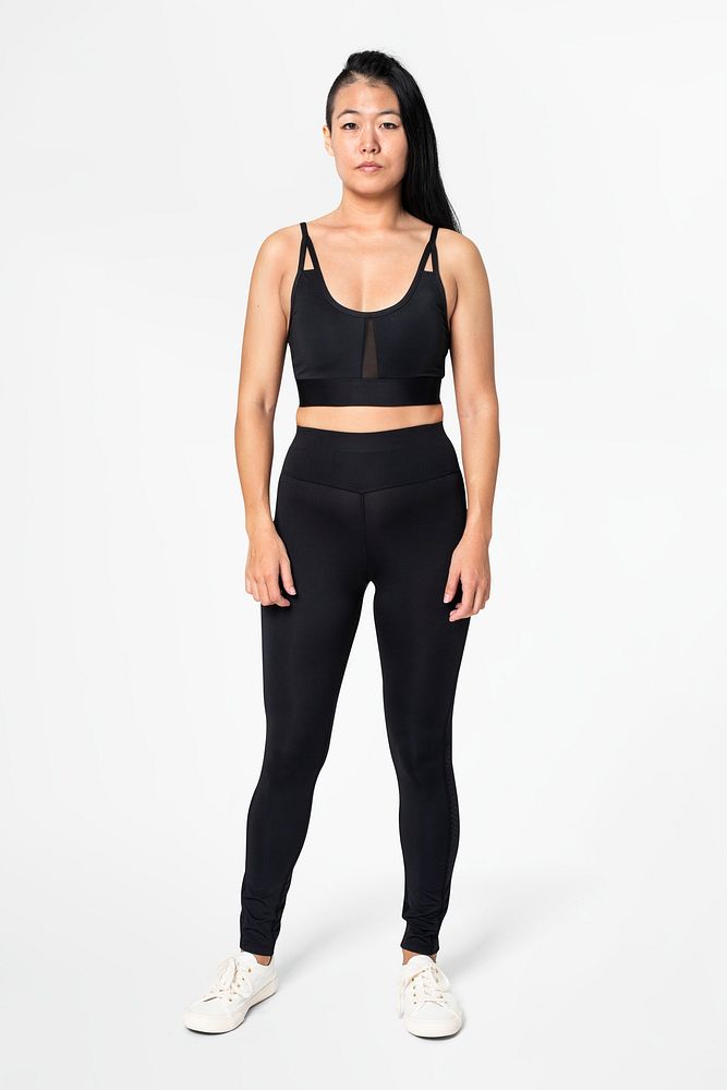 Woman in black sports bra and leggings activewear apparel full body
