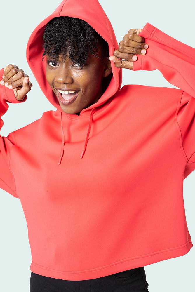 Sporty woman in red hoodie women&rsquo;s apparel photoshoot