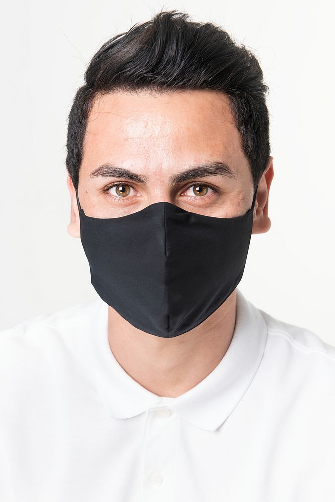 Man wearing black fabric mask for COVID-19 protection campaign