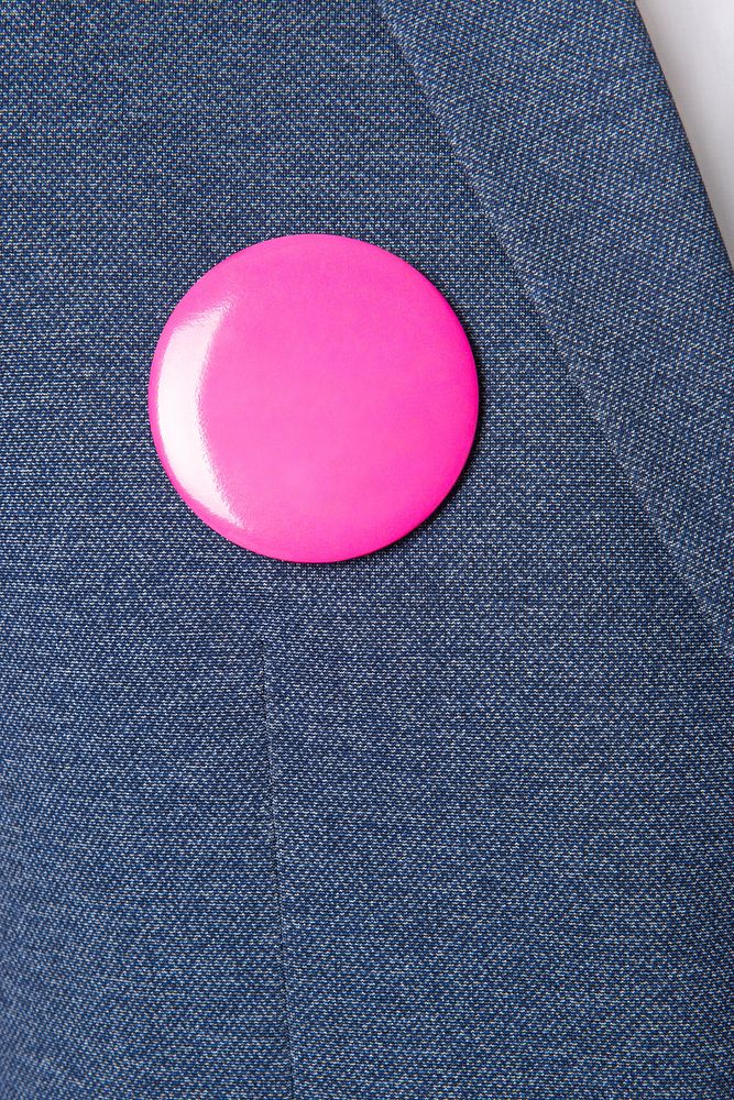 Pink brooch on blue blazer