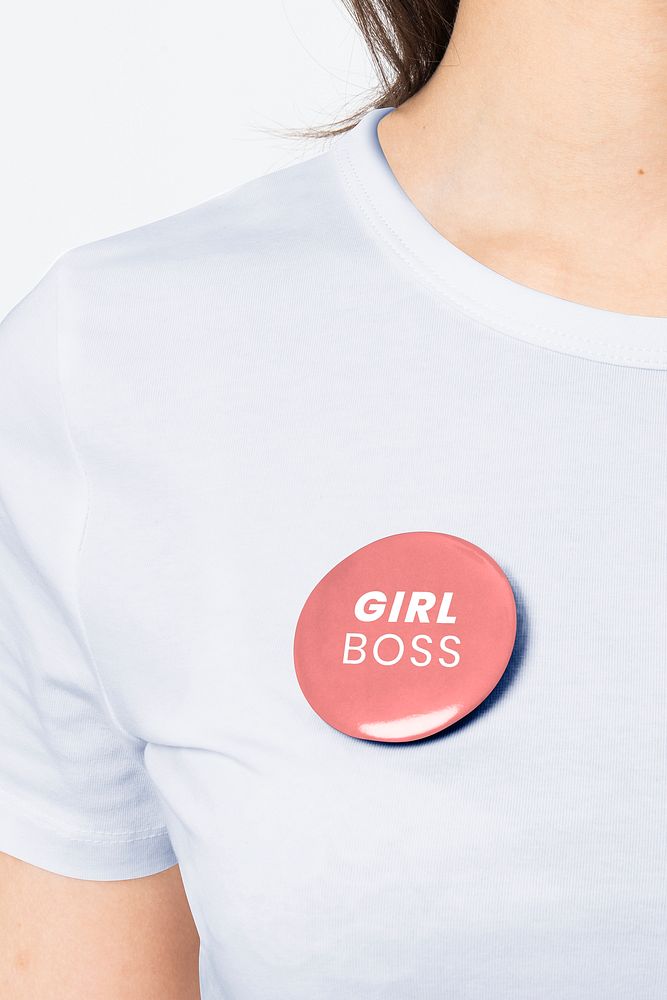 Girl Boss badge pin on a woman&rsquo;s t-shirt close up