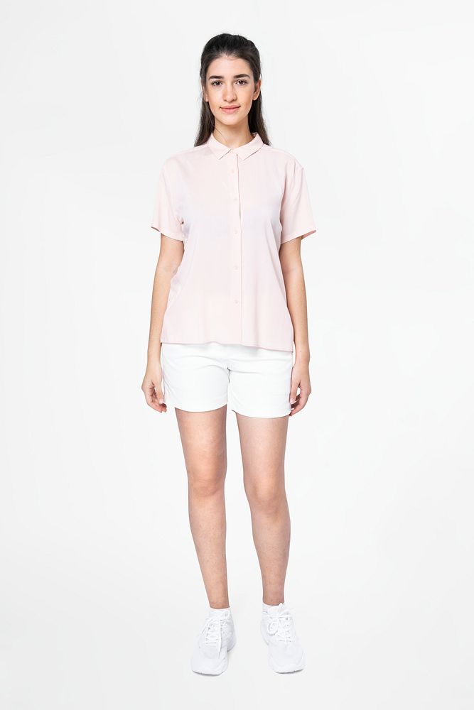 Woman in pink shirt and shorts casual apparel full body