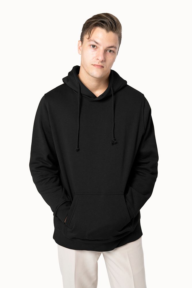 Handsome man wearing black hoodie for winter fashion studio shoot