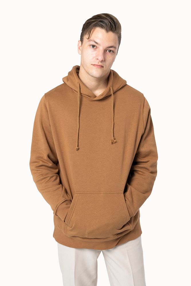 Handsome man wearing brown hoodie for winter fashion studio shoot