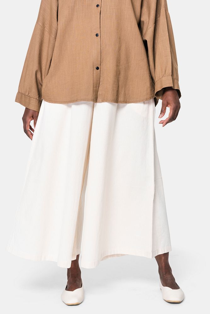 African American woman wearing white culotte pants