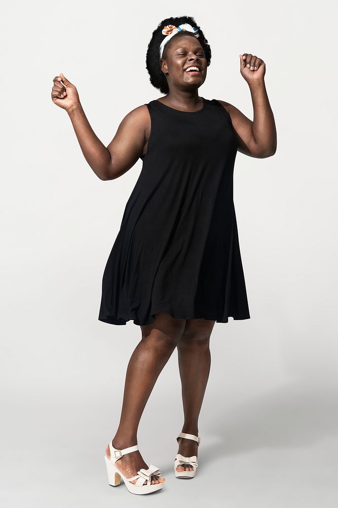 African American woman wearing black tent dress