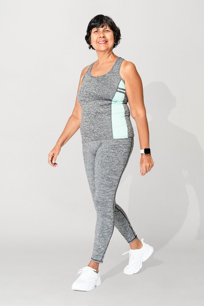 Senior woman in gray tank top and leggings sportswear fashion full body