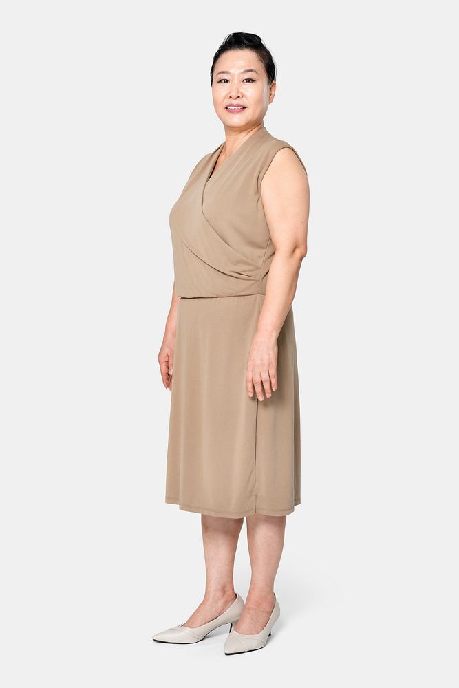 Asian woman in oversized brown blouson dress apparel