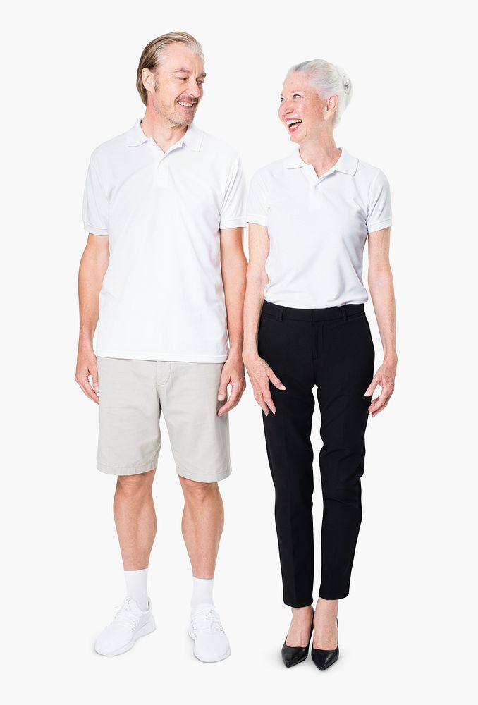 Happy senior couple in white polo shirts with design space studio portrait full body