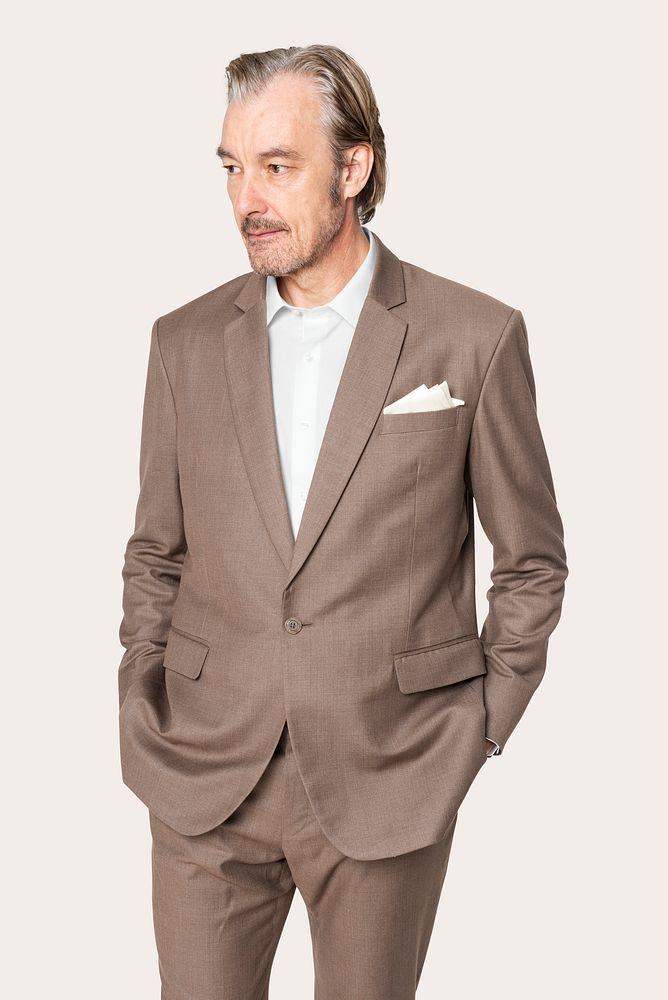 Businessman in brown suit studio portrait