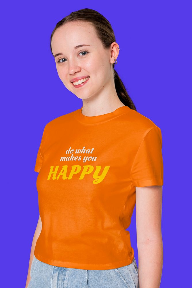 Teenage girl in orange tee printed with motivational quote youth apparel shoot
