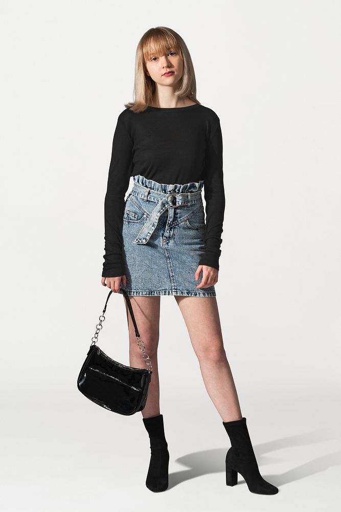 Girls&rsquo; black sweater psd mockup with denim skirt for youth apparel photoshoot