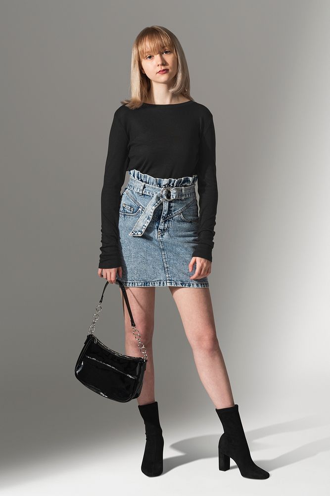 Girls&rsquo; black sweater psd mockup with denim skirt for teen&rsquo;s apparel photoshoot