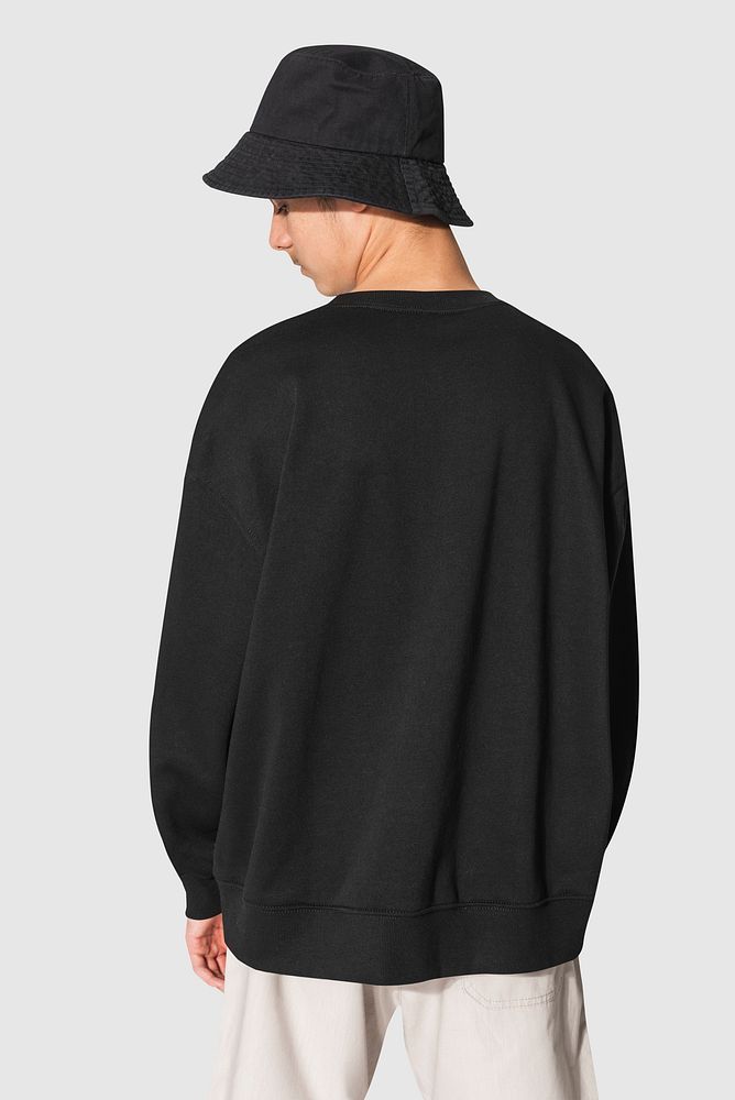 Man in black sweater and black bucket hat teen&rsquo;s apparel shoot