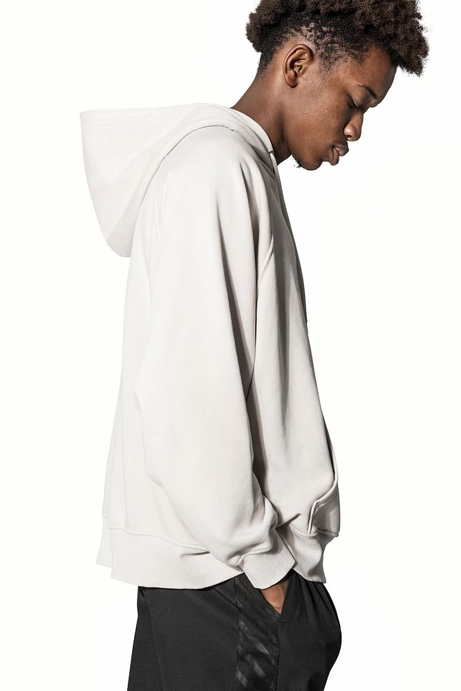 Teenage boy in beige hoodie winter fashion shoot