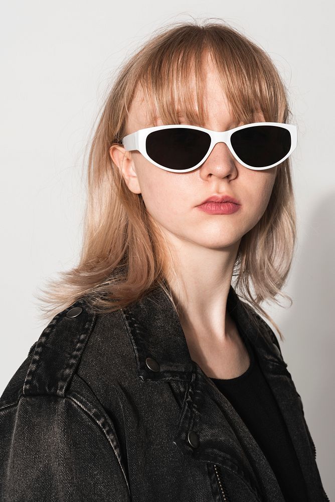 Blonde girl with white sunglasses for teenage fashion photoshoot