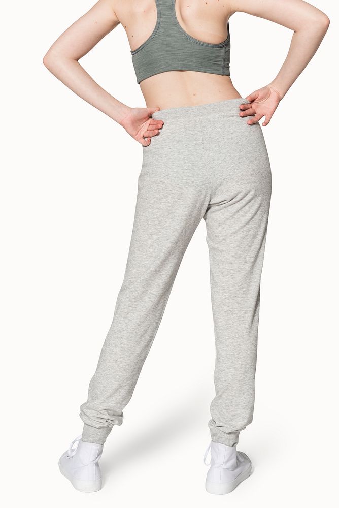 Sporty woman in sports bra and sweatpants for activewear photoshoot