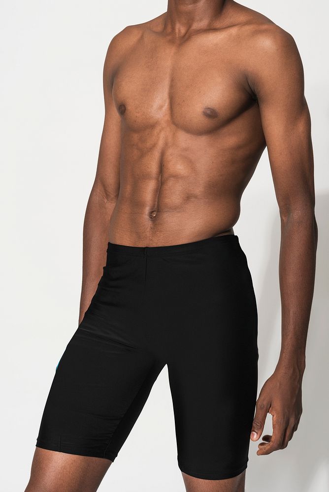 Man in black compression shorts for swimwear fashion shoot
