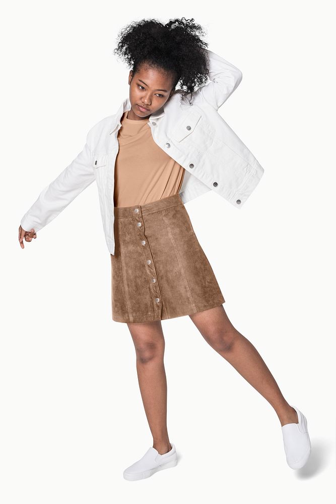 African American girl in white jacket and brown outfit street fashion shoot full body