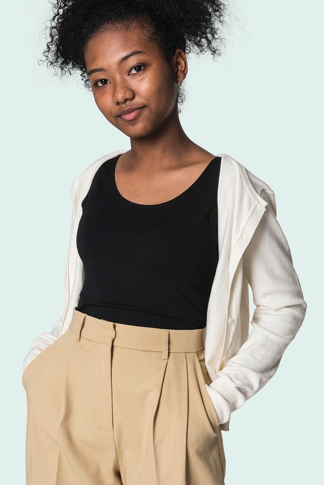 Black tee mockup psd with beige cardigan and trousers girls&rsquo; fashion studio shoot