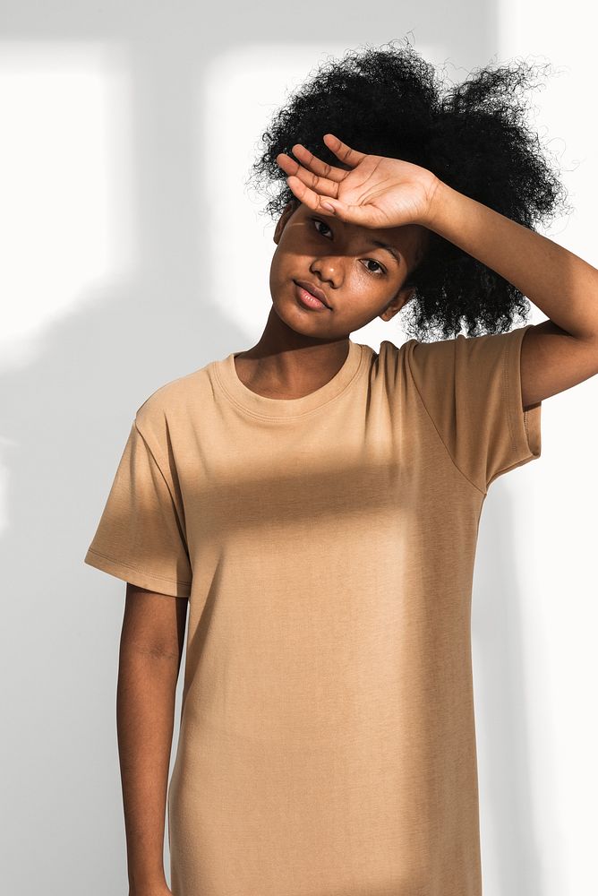 African American woman in brown t-shirt dress for apparel shoot