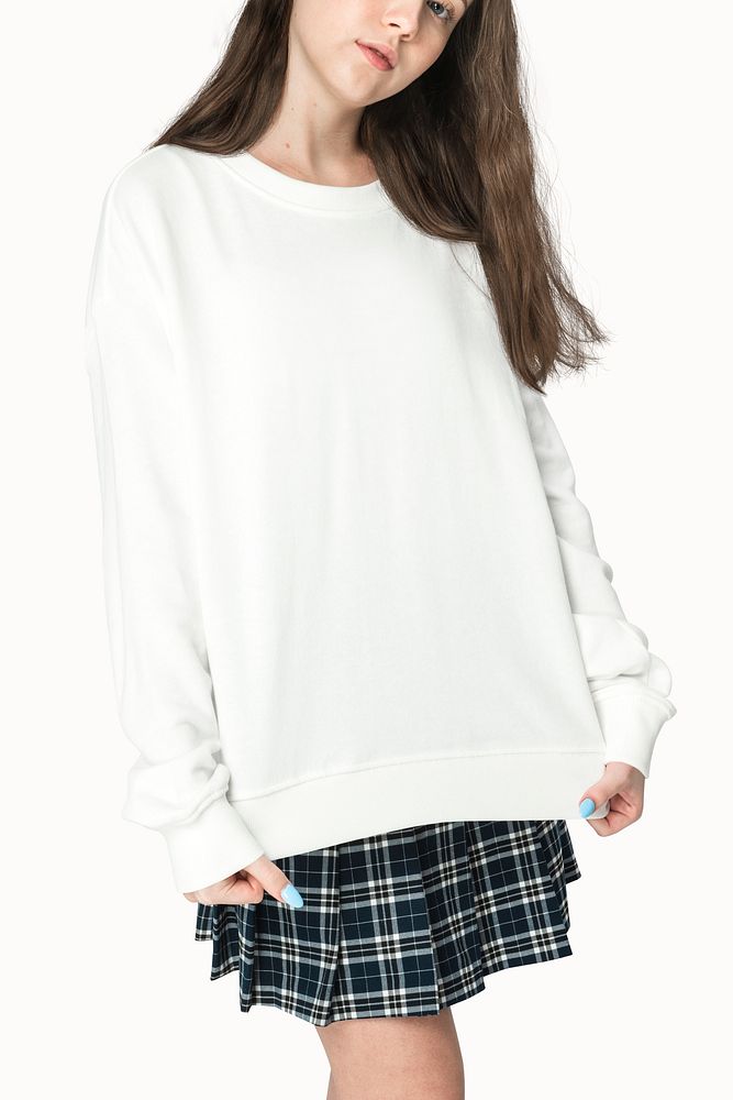 Teenage girl in white sweater apparel studio portrait