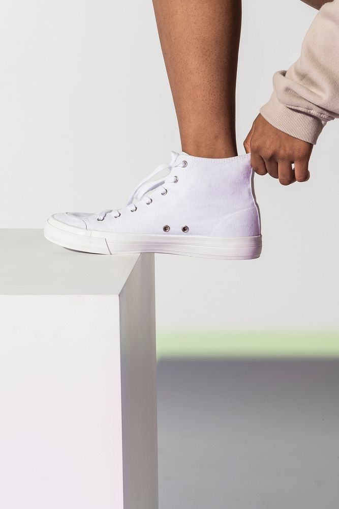 Unisex white sneakers close up/studio shot with design space