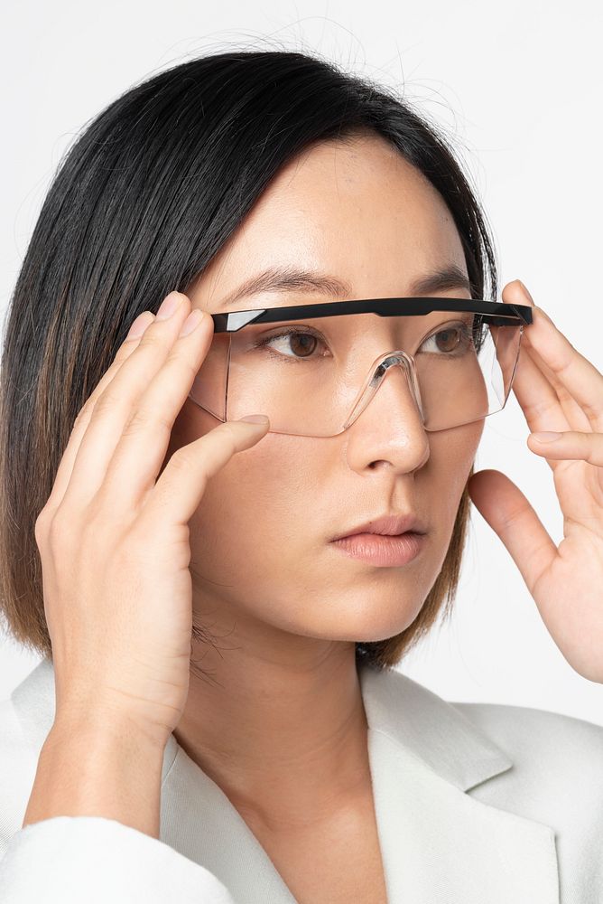 Businesswoman wearing AR glasses/AR smart glasses/smart glasses  futuristic technology