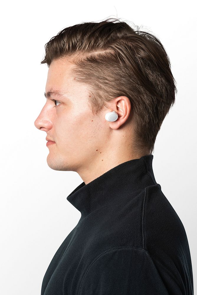 Man listening music with wireless earbuds