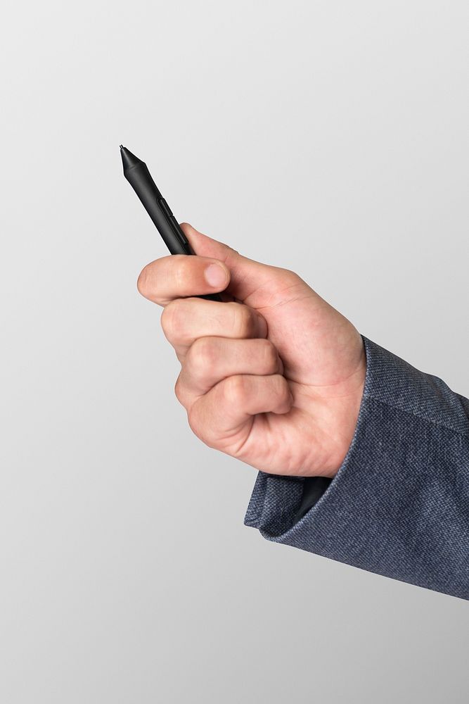 Hand holding smart pen mockup psd futuristic technology
