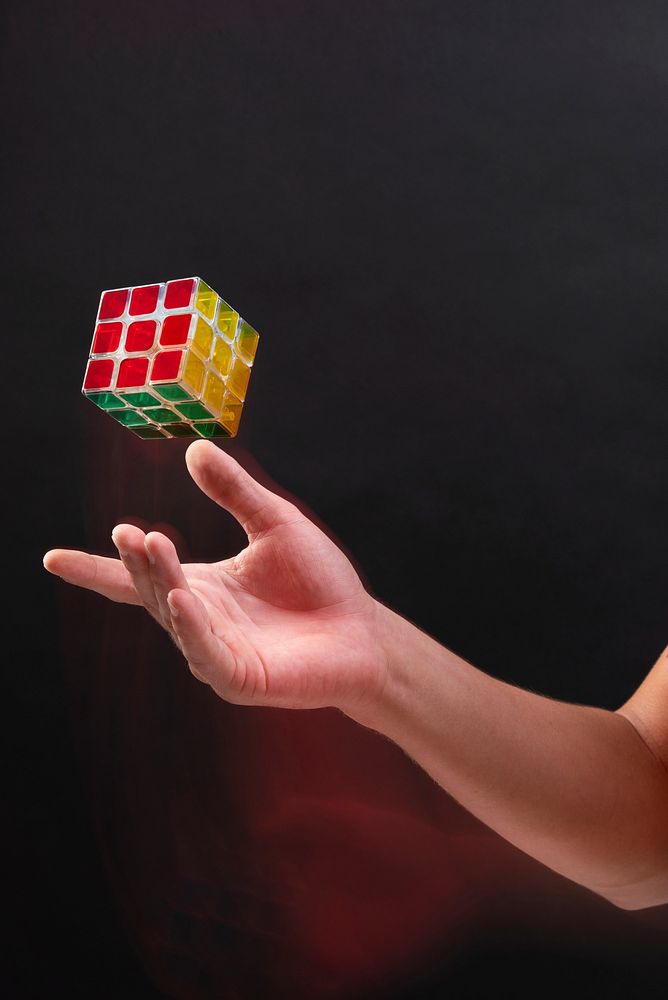 Businessman holding puzzle cube